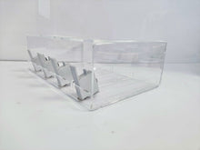 Side view of the nicotine pouch display stand showing the four grey pushers