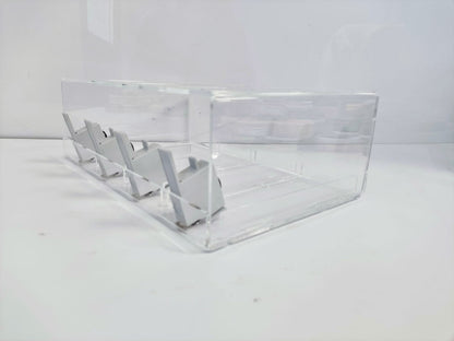 Side view of the nicotine pouch display stand showing the four grey pushers