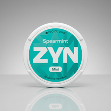 ZYN Spearmint Mini 3mg Nicotine Pouches tin with teal label on a white reflective studio background.